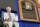 COOPERSTOWN, NY - JULY 25:  2010 inductee Doug Harvey sits behind his plaque as his pre-recorded speech is heard at Clark Sports Center during the Baseball Hall of Fame induction ceremony on July 25, 20010 in Cooperstown, New York. Harvey served as a National League umpire for 31 seasons working 4,673 regular season games as well as working five World Series.  (Photo by Jim McIsaac/Getty Images)