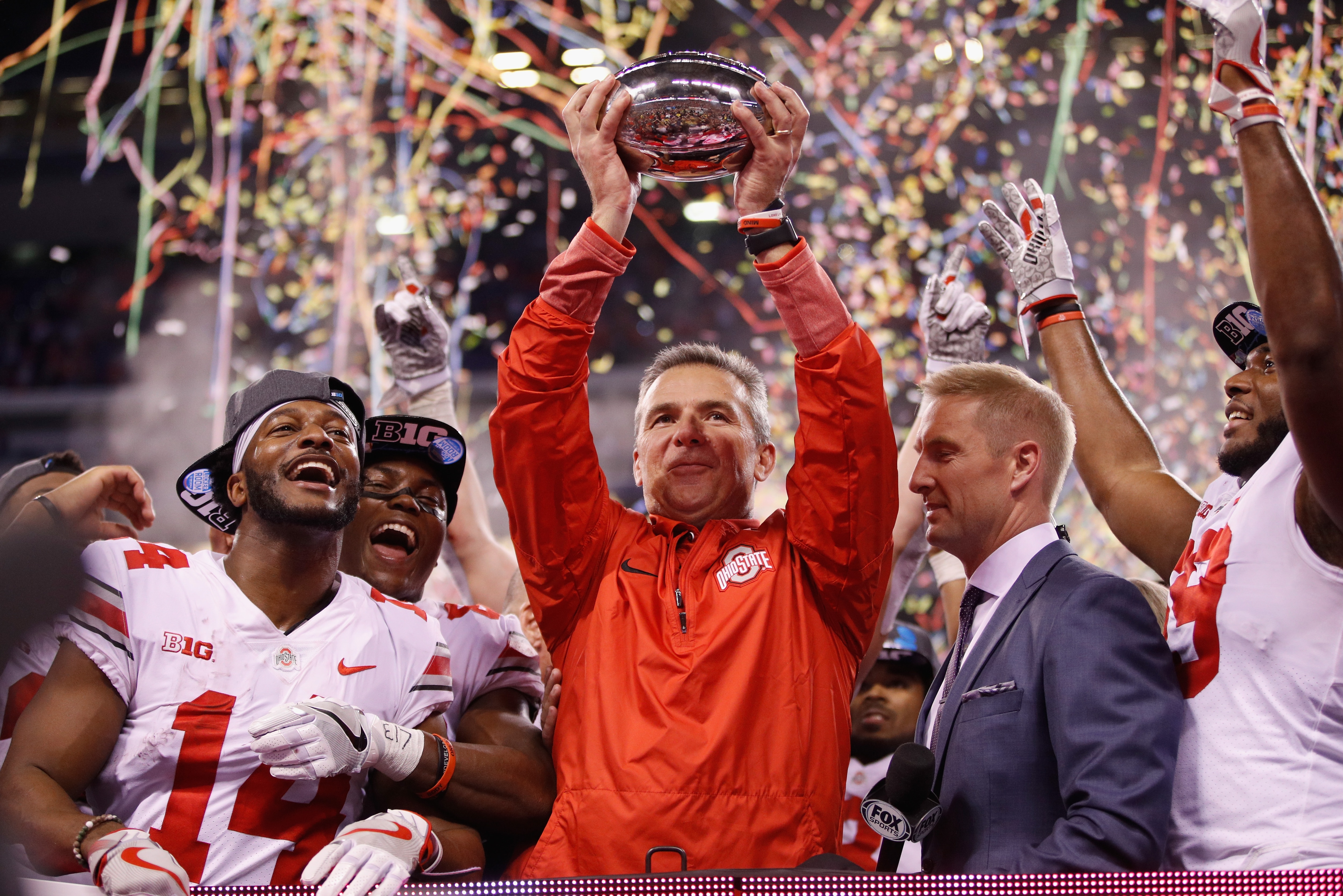 INDIANAPOLIS, IN - DECEMBER 02: Head coach Urban Meyer of the Ohio State Buckeyes celebrates with the trophy after their 27-21 win over the Wisconsin Badgers during the Big Ten Championship game at Lucas Oil Stadium on December 2, 2017 in Indianapolis, Indiana. (Photo by Joe Robbins/Getty Images)