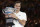 Switzerland's Roger Federer holds his trophy after defeating Croatia's Marin Cilic in the men's singles final at the Australian Open tennis championships in Melbourne, Australia, Sunday, Jan. 28, 2018. (AP Photo/Dita Alangkara)