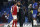 Chelsea head coach Antonio Conte, center, talks with Arsenal's Alexis Sanchez at the end of the English League Cup semifinal, first leg, soccer match between Chelsea and Arsenal at Stamford Bridge stadium in London, Wednesday, Jan. 10, 2018. (AP Photo/Kirsty Wigglesworth)