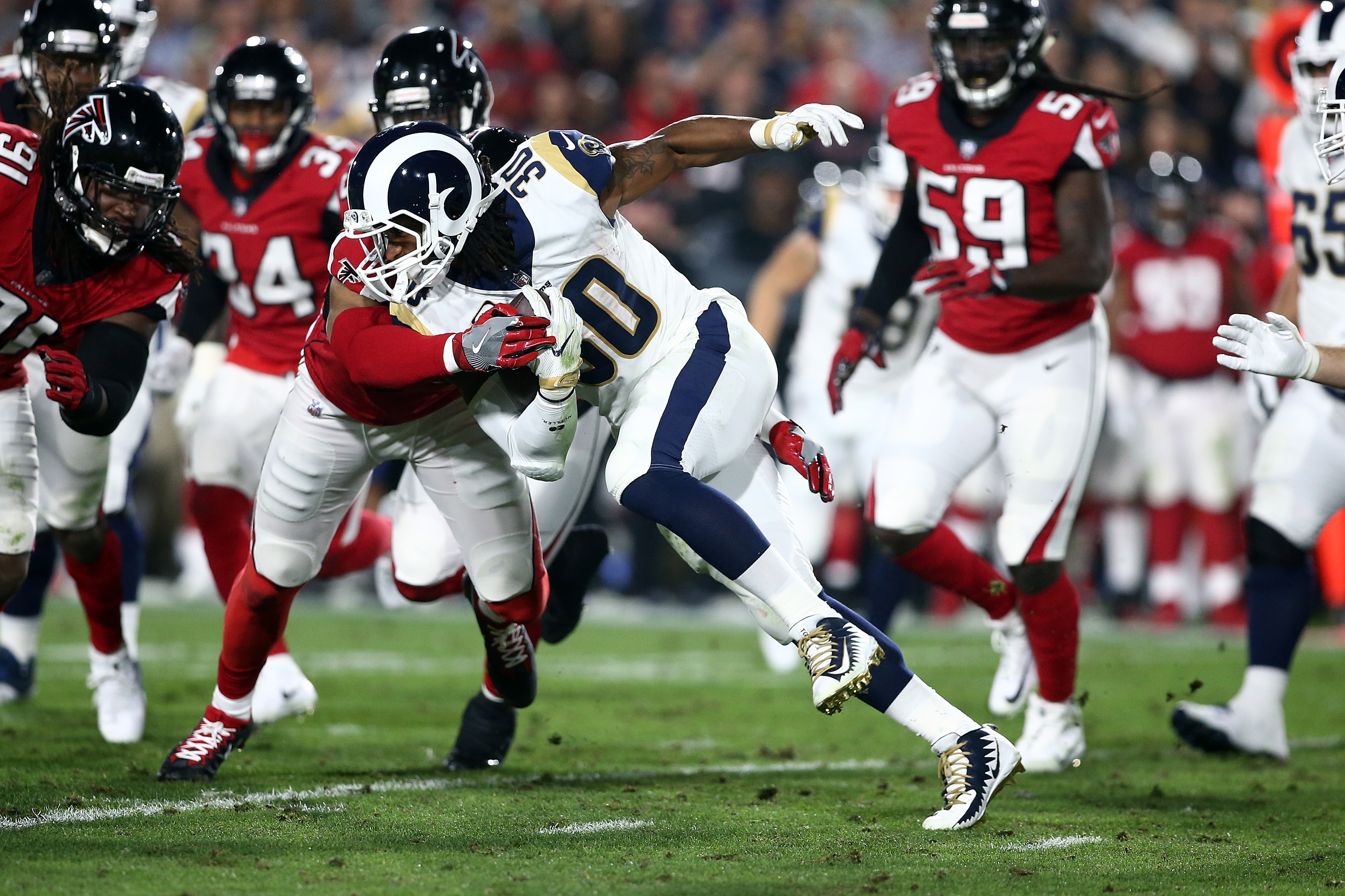 LOS ANGELES, CA - JANUARY 06: Todd Gurley #30 of the Los Angeles Rams runs the ball down field during the NFC Wild Card Playoff Game against the Atlanta Falcons at the Los Angeles Coliseum on January 6, 2018 in Los Angeles, California. (Photo by Sean M. Haffey/Getty Images)