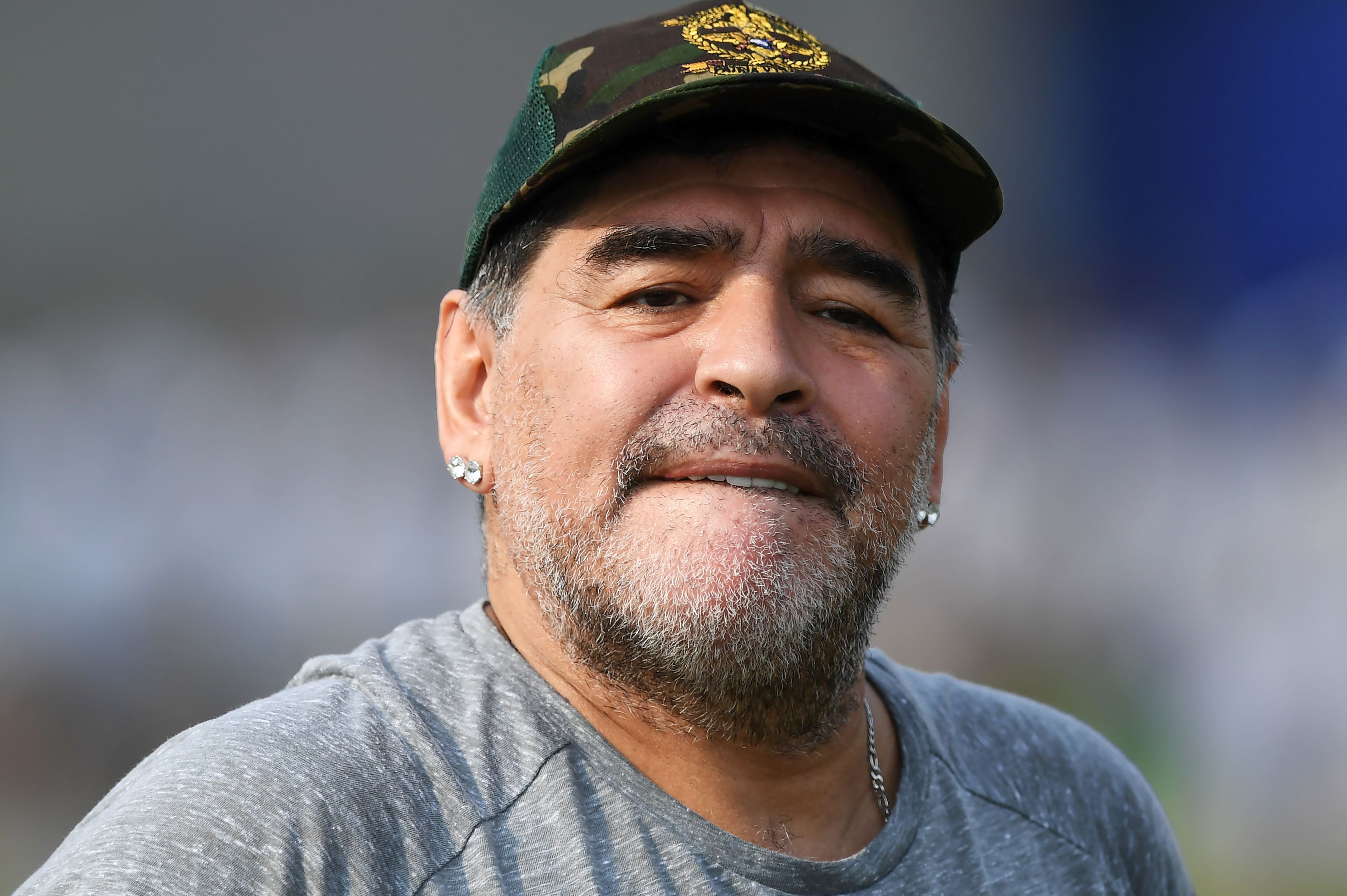 Argentine footballer Diego Maradona gestures during a football workshop with school students in Barasat, around 35 Km north of Kolkata on December 12, 2017.
Maradona is on a private visit to India. / AFP PHOTO / Dibyangshu SARKAR        (Photo credit should read DIBYANGSHU SARKAR/AFP/Getty Images)