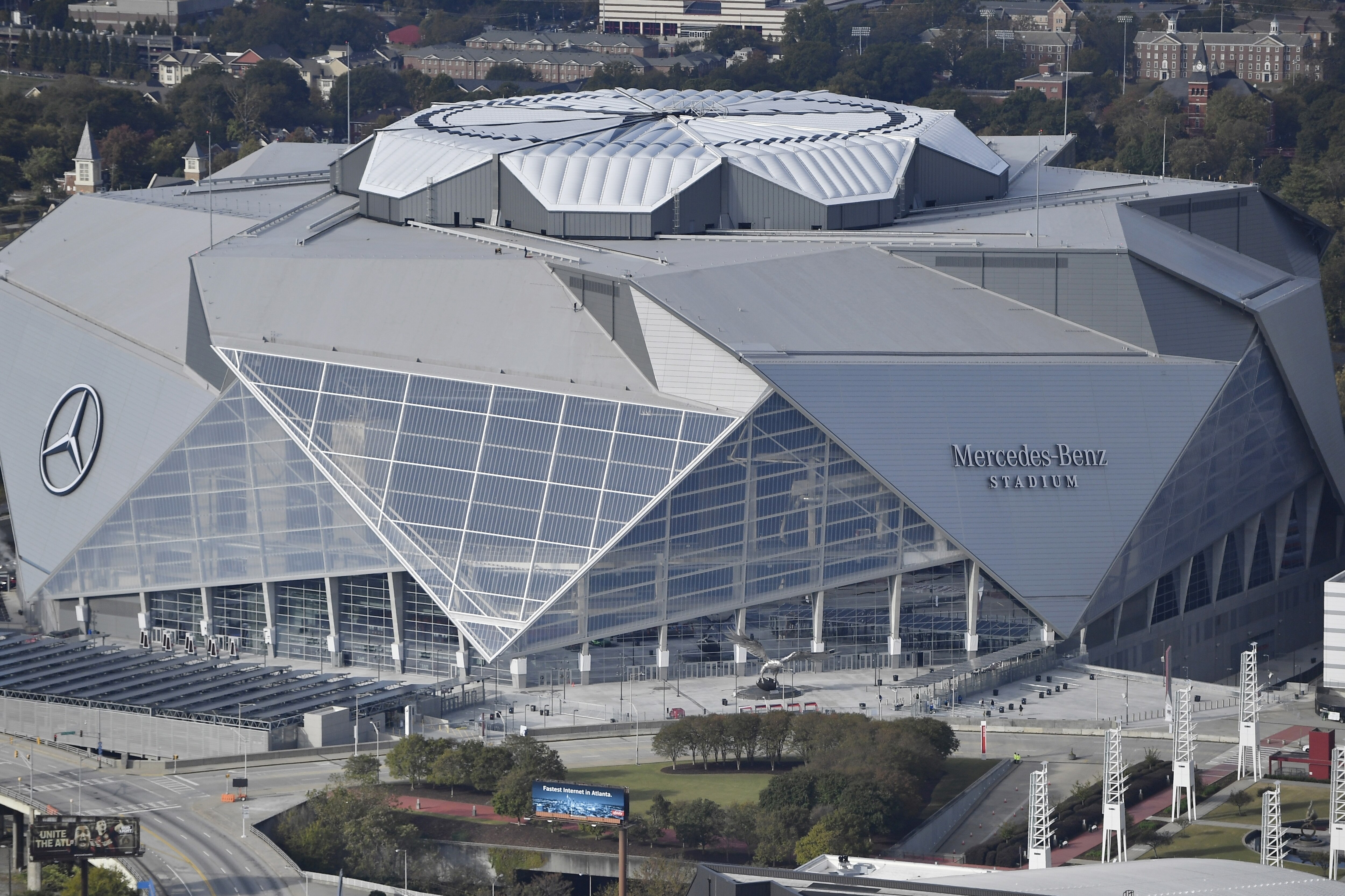 FILE - This Nov. 1, 2017, file photo shows the Mercedes-Benz stadium in Atlanta. Atlanta’s new $1.5 billion stadium is about to be on perhaps its largest national stage for the Monday, Jan. 8, 2018, College Football Playoff title game, fans say the glitzy facility is living up to the hype despite a series of construction setbacks that delayed its opening. (AP Photo/Mike Stewart, File)