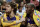Los Angeles Lakers center Pau Gasol, left, of Spain, holds on to the arm of guard Kobe Bryant as time runs out in the fourth quarter of the Lakers' 102-84 victory over the Denver Nuggets in Game 3 of their NBA first-round playoff basketball series in Denver on Saturday, April 26, 2008. The Lakers have won all three games of the best-of-seven game series as they head into Game 4 on Monday night. (AP Photo/Jack Dempsey)