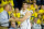 FILE - In this Dec. 22, 2014, file photo, Michigan head coach John Beilein, left, congratulates guard Austin Hatch (30) as he comes off the court in the second half of an NCAA college basketball game against Coppin State at Crisler Center in Ann Arbor, Mich. Michigan basketball coach John Beilein has announced that Austin Hatch will go on a medical scholarship and remain with the Wolverines as an undergraduate student assistant. Hatch survived two airplane crashes eight years apart, including a 2011 crash that severely injured him and killed his father and stepmother. Hatch's mother, brother and sister were killed in the first crash. He played in five games as a freshman last season. Beilein said the school received approval from the Big Ten on Monday, April 27, 2015, for a medical exemption waiver. (AP Photo/Tony Ding, File)
