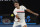 Switzerland's Roger Federer makes a forehand return to Tomas Berdych of the Czech Republic during their quarterfinal at the Australian Open tennis championships in Melbourne, Australia, Wednesday, Jan. 24, 2018. (AP Photo/Vincent Thian)