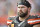 File- This Oct. 22, 2017, file photo shows Cleveland Browns offensive tackle Joe Thomas  walking on the sideline during an NFL football game against the Tennessee Titans, in Cleveland. Thomas says Cleveland’s coaching situation will have no bearing on his decision whether to keep playing. Thomas played in just seven games before tearing his left triceps on Oct. 22 against Tennessee and undergoing season-ending surgery. Before he got hurt, Thomas, a 10-time Pro Bowler, never missed a snap in his NFL career, playing 10,363 consecutive offensive snaps. The 33-year-old put off his decision on continuing his career until the offseason.  (AP Photo/David Richard, File)
