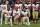 FILE - In this Dec. 10, 2017, file photo, San Francisco 49ers San Francisco 49ers' Eli Harold (57), Eric Reid (35) and Marquise Goodwin (11) kneel during the national anthem before an NFL football game against the Houston Texans, in Houston. President Donald Trump's feud with the NFL about players kneeling during the national anthem is the runaway winner for the top sports story of 2017 in balloting by AP members and editors.  (AP Photo/David J. Phillip, File)