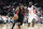 Toronto Raptors' DeMar DeRozan (10) drives the ball past Houston Rockets' James Harden (13) in the first half of an NBA basketball game Monday, Nov. 11, 2013, in Houston. (AP Photo/Pat Sullivan)
