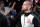 CM Punk walks to the octagon before a welterweight bout at UFC 203 on Saturday, Sept. 10, 2016, in Cleveland. (AP Photo/David Dermer)