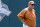 FILE - In this June 17, 2011, file photo, Texas' coach Augie Garrido surveys the playing field during NCAA college baseball practice at TD Ameritrade Park in Omaha, Neb. Garrido, who won three national baseball championships at Cal State Fullerton and two more at Texas, has died, the University of Texas announced Thursday, March 15, 2018. He was 79. (AP Photo/Dave Weaver, File)
