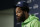 Seattle Seahawks defensive end Michael Bennett talks to reporters following an NFL football game against the Los Angeles Rams, Sunday, Dec. 17, 2017, in Seattle. The Rams won 42-7. (AP Photo/John Froschauer)