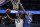 Minnesota Timberwolves' Jimmy Butler (23) goes to the basket past Orlando Magic's Bismack Biyombo, right, during the first half of an NBA basketball game, Tuesday, Jan. 16, 2018, in Orlando, Fla. (AP Photo/John Raoux)