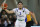 BC Prienu Vytautas's LiAngelo Ball in action during the Big Baller Brand Challenge friendly tournament match between BC Prienu Vytautas and BC Zalgiris-2 at the BC Prienai-Birstonas Vytautas arena, in Prienai, Lithuania, Tuesday, Jan. 9, 2018. LiAngelo Ball and LaMelo Ball, sons of former basketball player LaVar Ball, have signed a one-year contract and play their first match for Lithuanian professional basketball club Prienu Vytautas. (AP Photo/Liusjenas Kulbis)