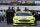 The crew of Paul Menard pushes his car through the pits after practice for a  NASCAR Cup series auto race, Friday, April 13, 2018, in Bristol, Tenn. (AP Photo/Wade Payne)