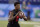 Louisville quarterback Lamar Jackson runs a drill at the NFL football scouting combine in Indianapolis, Saturday, March 3, 2018. (AP Photo/Michael Conroy)
