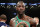 FILE - In this March 3, 2018, file photo, Deontay Wilder poses for photographs after the WBC heavyweight champion defeated Luis Ortiz in New York. Wilder says he’s ready to fight Anthony Joshua in a heavyweight unification bout, and is willing to travel overseas. Wilder cancelled a scheduled media conference call Tuesday, April 3, 2018, instead issuing a statement saying he’s “ready to come to the (United Kingdom) for my next fight.” (AP Photo/Frank Franklin II, File)