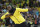 Jamaica's Usain Bolt makes his trademark gesture during a lap of honor at the end of the World Athletics Championships in London Sunday, Aug. 13, 2017. (AP Photo/Matthias Schrader)