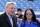 Buffalo Bills owner Terry Pegula, left, and his wife Kim Pegula walk on the field prior to an NFL football game against the Houston Texans, Sunday, Dec. 6, 2015, in Orchard Park, N.Y. (AP Photo/Gary Wiepert)