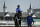 Kentucky Derby hopeful Enticed is led off the track after a morning workout at Churchill Downs Tuesday, May 1, 2018, in Louisville, Ky. The 144th running of the Kentucky Derby is scheduled for Saturday, May 5. (AP Photo/Charlie Riedel)