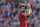 Liverpool's Egyptian midfielder Mohamed Salah applauds fans as he is substituted during the English Premier League football match between Liverpool and Brighton and Hove Albion at Anfield in Liverpool, north west England on May 13, 2018. (Photo by Paul ELLIS / AFP) / RESTRICTED TO EDITORIAL USE. No use with unauthorized audio, video, data, fixture lists, club/league logos or 'live' services. Online in-match use limited to 75 images, no video emulation. No use in betting, games or single club/league/player publications. /         (Photo credit should read PAUL ELLIS/AFP/Getty Images)