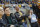 West Virginia Athletic Director Oliver Luck, center, watches a women's NCAA college basketball game between Baylor and West Virginia at WVU Coliseum in Morgantown, W.Va., on Saturday, March 2, 2013. (AP Photo/David Smith)