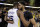 New Orleans Pelicans' Anthony Davis, right, is hugged by Golden State Warriors' Kevin Durant at the end of Game 5 of an NBA basketball second-round playoff series Tuesday, May 8, 2018, in Oakland, Calif. Golden State won 113-104 to win the series. (AP Photo/Marcio Jose Sanchez)