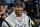 Retired Denver Nuggets guard Allen Iverson smiles as he jokes with fans before taking a seat to watch the Nuggets play the San Antonio Spurs in an NBA basketball game Friday, Feb. 23, 2018, in Denver. Iverson joined former teammates Kenyon Martin and Marcus Camby to be honored by the team during a ceremony at halftime. (AP Photo/David Zalubowski)