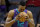 Charlotte Hornets' Dwight Howard (12) kisses the basketball before the start of an NBA basketball game against the Indiana Pacers in Charlotte, N.C., Sunday, April 8, 2018. (AP Photo/Chuck Burton)