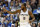 San Antonio Spurs forward Kawhi Leonard (2) celebrates sinking a basket in the first half of an NBA basketball game against the Dallas Mavericks onTuesday, Dec. 12, 2017, in Dallas. (AP Photo/Tony Gutierrez)