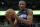 Orlando Magic's Bismack Biyombo grabs a rebound against the Boston Celtics during the second half of an NBA basketball game, Friday, March 16, 2018, in Orlando, Fla. (AP Photo/John Raoux)