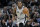 San Antonio Spurs forward Kawhi Leonard (2) moves the ball up court during the second half of an NBA basketball game against the Denver Nuggets, Saturday, Jan. 13, 2018, in San Antonio. San Antonio won 112-80. (AP Photo/Eric Gay)