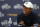 Tiger Woods of the United States smiles as answers a question at a press conference for the 147th British Open Golf championships in Carnoustie, Scotland, Tuesday, July 17, 2018. The Opens Golf championships start Thursday. (AP Photo/Alastair Grant)