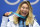 TOPSHOT - USA's gold medallist Chloe Kim poses on the podium during the medal ceremony for the snowboard women's Halfpipe at the Pyeongchang Medals Plaza during the Pyeongchang 2018 Winter Olympic Games in Pyeongchang on February 13, 2018. / AFP PHOTO / Kirill KUDRYAVTSEV        (Photo credit should read KIRILL KUDRYAVTSEV/AFP/Getty Images)