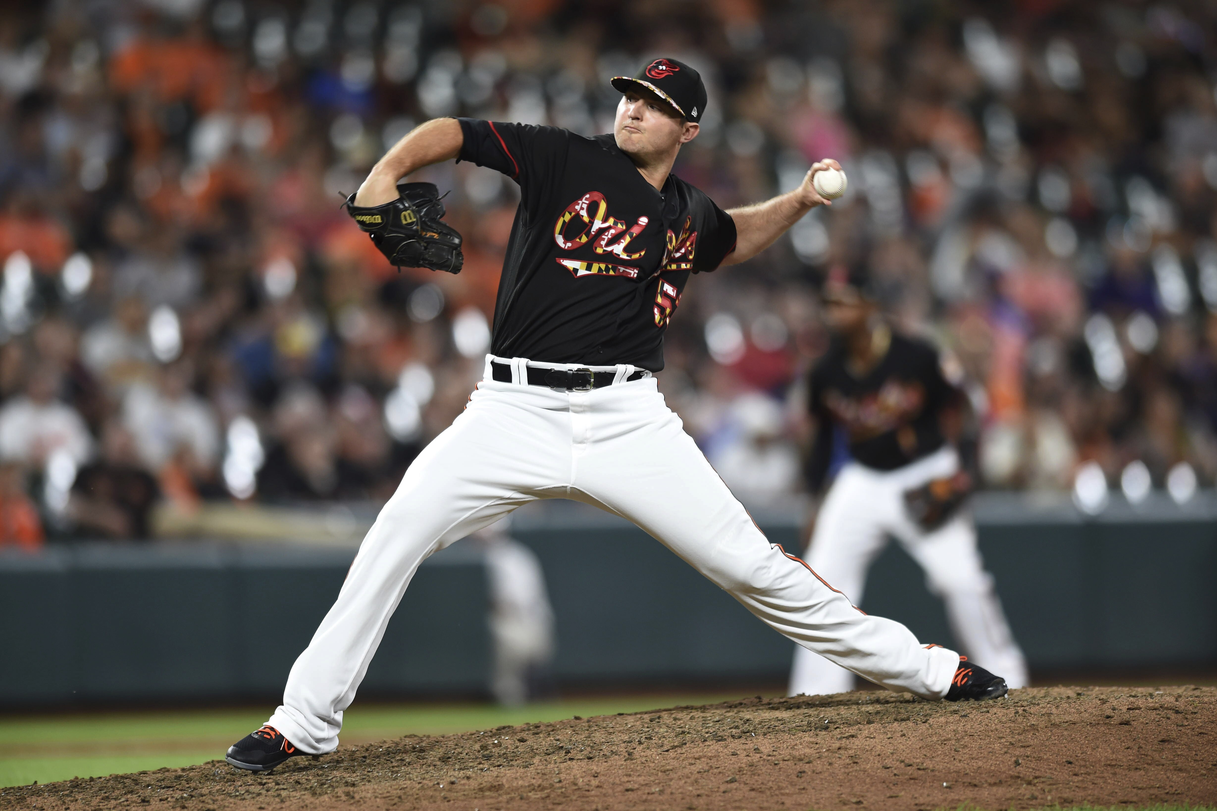 Baltimore Orioles' Zach Britton throws against the Texas Rangers in the ninth inning of a baseball game, Saturday, July 14, 2018, in Baltimore. (AP Photo/Gail Burton)