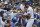 Chicago Cubs' Kris Bryant, right, autographs for fans before a baseball game against the St. Louis Cardinals, Sunday, July 22, 2018, in Chicago. (AP Photo/Nam Y. Huh)