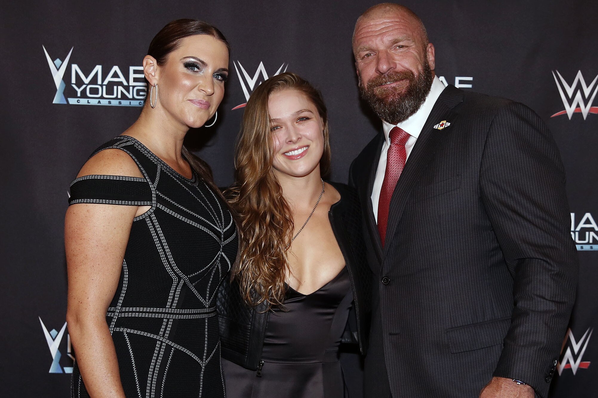 IMAGE DISTRIBUTED FOR WWE - WWE Chief Brand Officer Stephanie McMahon, left, Ronda Rousey, center, and WWE EVP of Talent, Live Events and Creative Paul