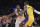 Los Angeles Clippers guard Lou Williams, left, tires to dribble past Los Angeles Lakers guard Kentavious Caldwell-Pope during the first half of an NBA basketball game, Friday, Dec. 29, 2017, in Los Angeles. (AP Photo/Mark J. Terrill)