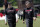 Atlanta Falcons general manger Thomas Dimitroff right, and head coach Dan Quinn walks together after the team's rookie camp football practice Friday, May 11, 2018, in Flowery Branch, Ga. (AP Photo/John Bazemore)