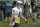 New England Patriots wide receiver Julian Edelman walks past members of the media as he steps on the field at the start of an NFL football practice, Thursday, July 26, 2018, in Foxborough, Mass. (AP Photo/Steven Senne)
