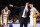 Los Angeles Lakers forward Brandon Ingram #14, looks on as head coach Luke Walton talks to guard Lonzo Ball #2 during the first half of an NBA basketball game Sunday, Nov. 19, 2017, in Los Angeles. (AP Photo/Ringo H.W. Chiu)