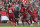 Liverpool's Egyptian midfielder Mohamed Salah (C) celebrates with teammates after scoring the opening goal of the English Premier League football match between Liverpool and West Ham United at Anfield in Liverpool, north west England on August 12, 2018. (Photo by Oli SCARFF / AFP) / RESTRICTED TO EDITORIAL USE. No use with unauthorized audio, video, data, fixture lists, club/league logos or 'live' services. Online in-match use limited to 120 images. An additional 40 images may be used in extra time. No video emulation. Social media in-match use limited to 120 images. An additional 40 images may be used in extra time. No use in betting publications, games or single club/league/player publications. /         (Photo credit should read OLI SCARFF/AFP/Getty Images)