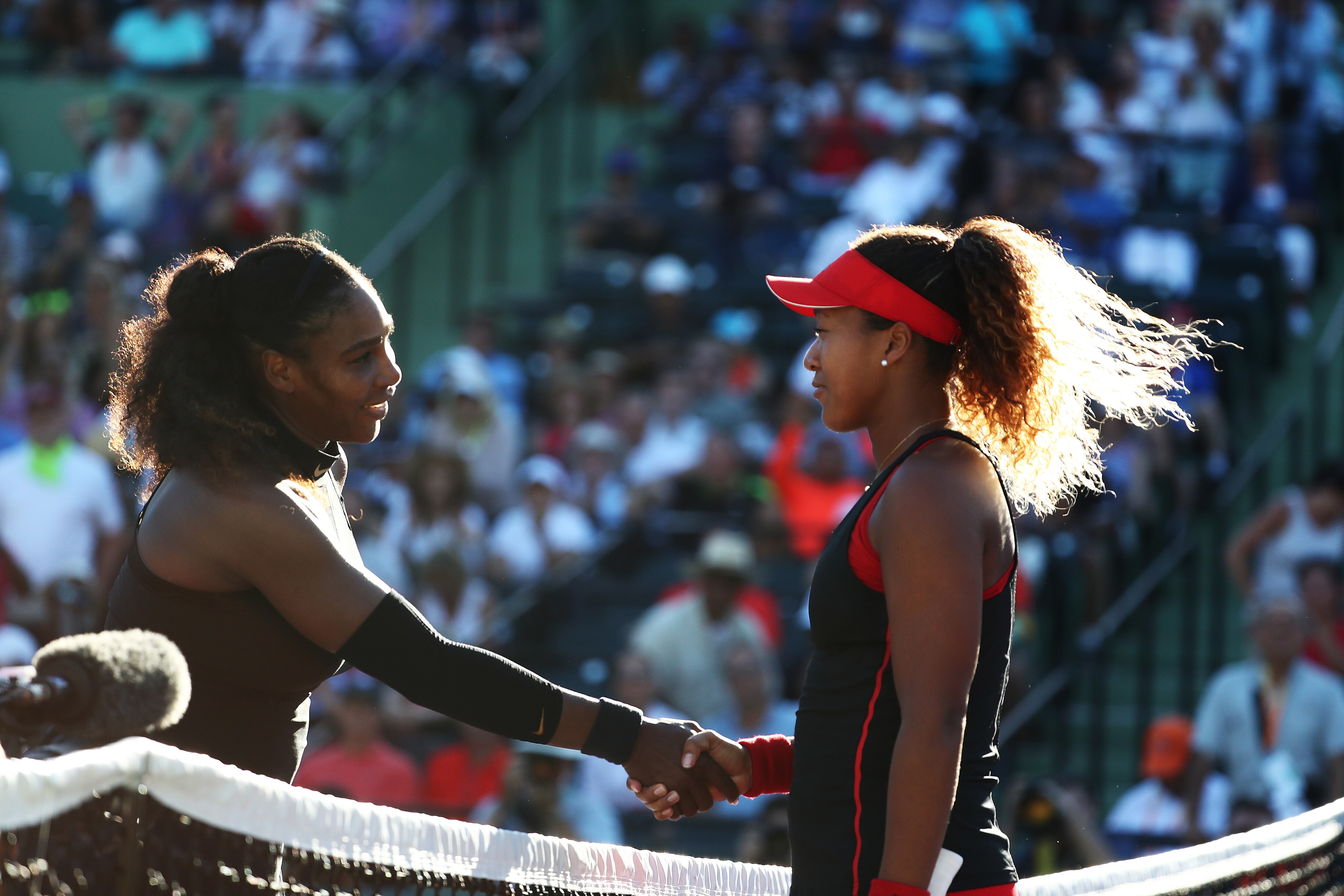 KEY BISCAYNE, FL - MARCH 21: Serena Williams meets Naomi Osaka of Japan after losing to her in straight sets during Day 3 of the Miami Open at the Crandon Park Tennis Center on March 19, 2018 in Key Biscayne, Florida. (Photo by Al Bello/Getty Images)