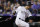 Colorado Rockies' Carlos Gonzalez watches his three-run triple off San Francisco Giants relief pitcher Ty Blach in the seventh inning of a baseball game Tuesday, Sept. 4, 2018, in Denver. (AP Photo/David Zalubowski)