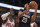 New Orleans Pelicans' Anthony Davis, right, goes to the basket against Chicago Bulls' Bobby Portis during the first half of a preseason NBA basketball game Sunday, Sept. 30, 2018, in Chicago. (AP Photo/Jim Young)