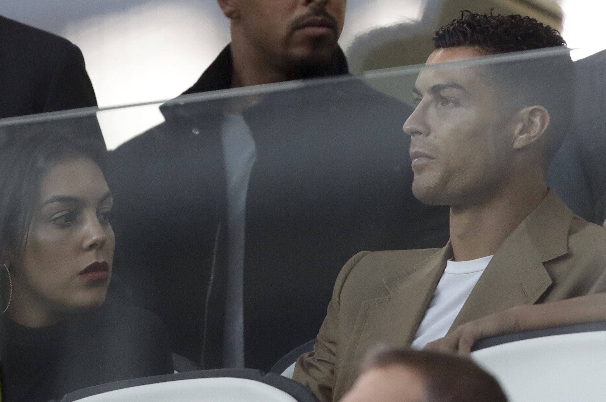 Juventus forward Cristiano Ronaldo and his partner Georgina sit in the stands prior to the Champions League, group H soccer match between Juventus and Young Boys, at the Allianz stadium in Turin, Italy, Tuesday, Oct. 2, 2018. (AP Photo/Luca Bruno)