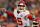FILE - In this Oct. 1, 2018, file photo, Kansas City Chiefs quarterback Patrick Mahomes (15) makes a call against the Denver Broncos during the first half of an NFL football game, in Denver. Chiefs wide receiver Tyreek Hill called his quarterback slow. Their coach, Andy Reid, said his quarterback’s voice was “froggish.” And Patrick Mahomes insists he can dish the trash talk just as well as he can receive it. It’s all part of a unique locker-room banter that has helped keep things light as Kansas City rolls up win after win. (AP Photo/David Zalubowski, File)