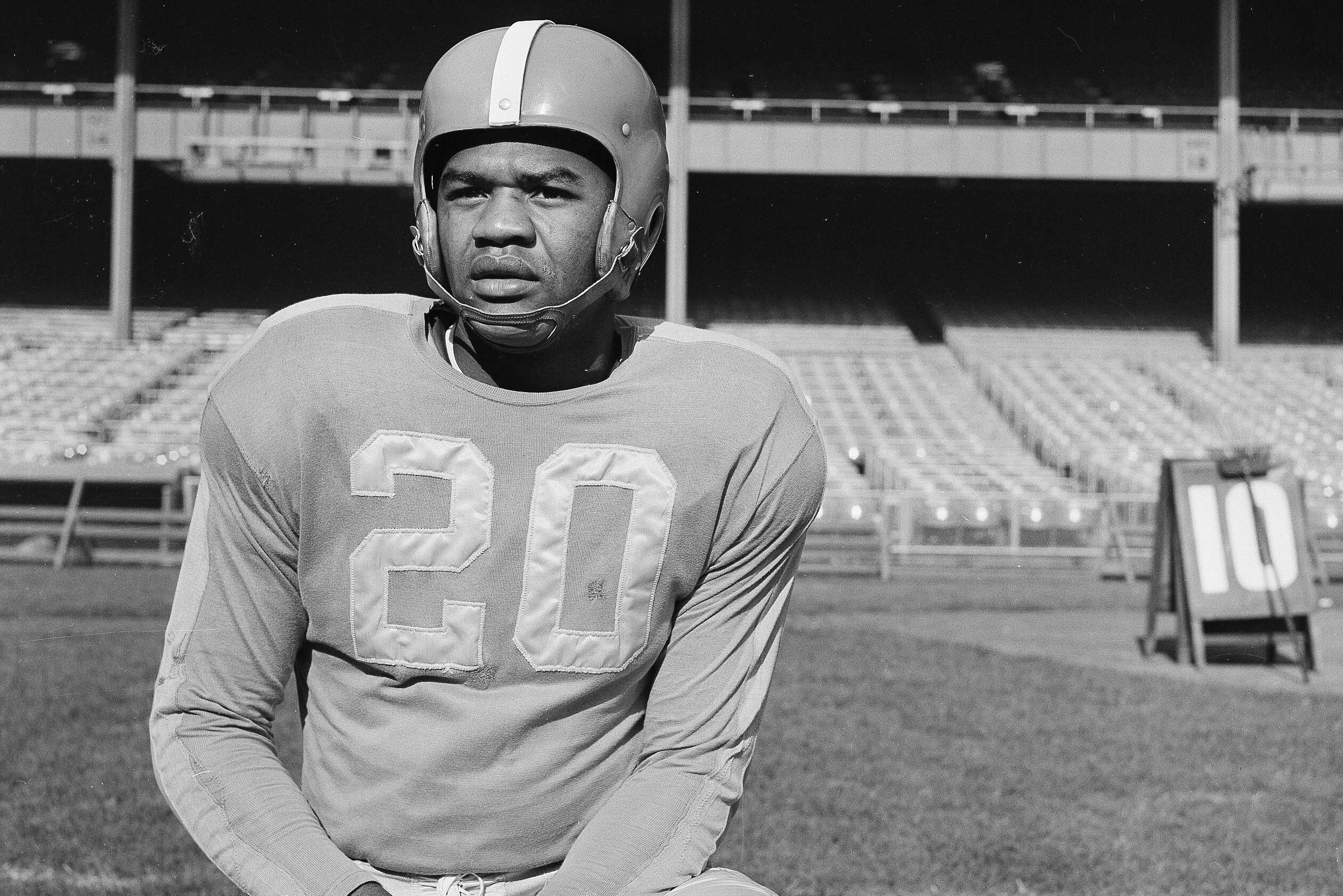 George Taliaferro (20) of the New York Yankees football team, is shown in New York, Nov. 2, 1950. Taliaferro was the first African-American to be drafted by an NFL team. (AP Photo/Murray Becker)