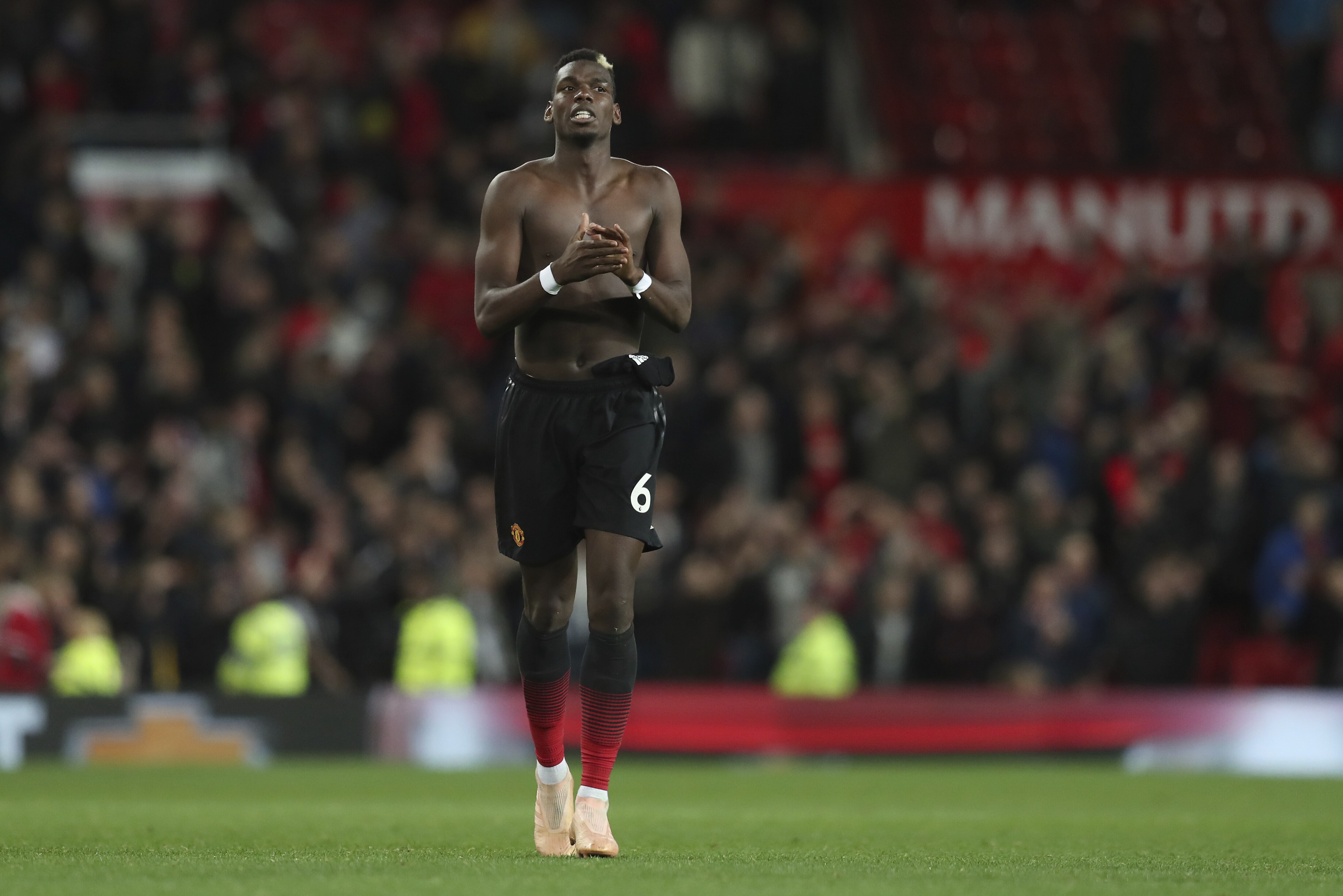 Manchester United's Paul Pogba goes off the pitch after the end of the English Premier League soccer match between Manchester United and Newcastle United at Old Trafford in Manchester, England, Saturday, Oct. 6, 2018. Man Utd won the game 3-2. (AP Photo/Jon Super)