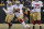 San Francisco 49ers quarterback Colin Kaepernick scrambles with the ball against the Green Bay Packers during an NFL wild-card playoff football game Sunday, Jan. 5, 2014, in Green Bay, Wis. (AP Photo/Matt Ludtke)